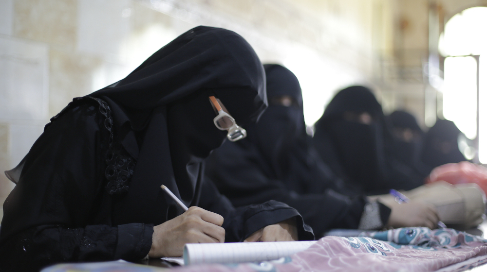 Women learn tailoring skills as part of a vocational training programme at a UNFPA-supported safe space. © UNFPA Yemen | Photo does not depict subject featured in story.