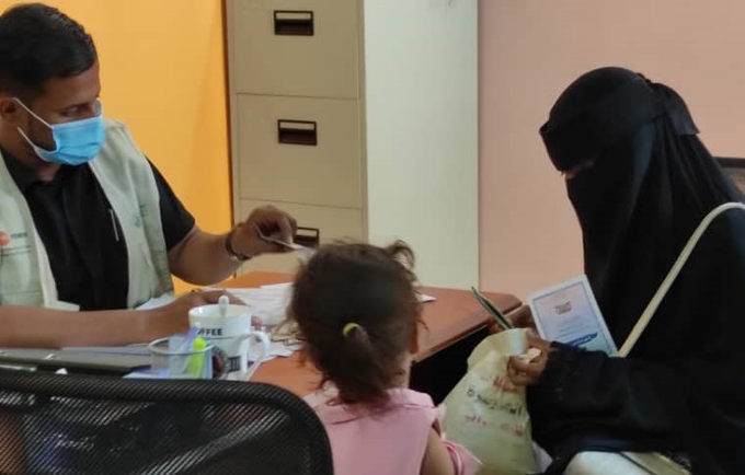Hala receiving her identification documents at the safe space. © UNFPA Yemen