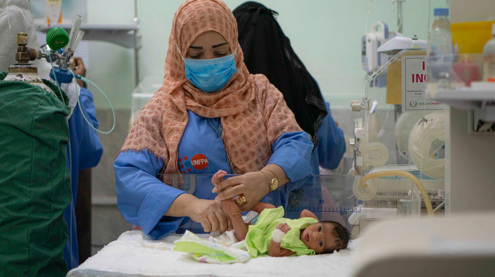  Aydah Mohamed takes care of newborns in the neonatal department of the UNFPA-supported Al Shaab Hospital in Aden, Yemen. ©UNFPA