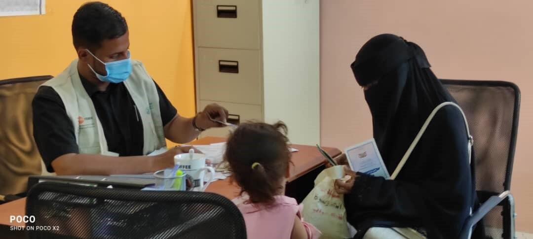 Hala receiving her identification documents at the safe space. © UNFPA Yemen